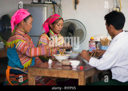 Colorful ethnic Flower Hmong Women at Bac Ha Market. Flower H'mong ethnic minority group from Sapa, Lao Cai, Vietnam Stock Photo