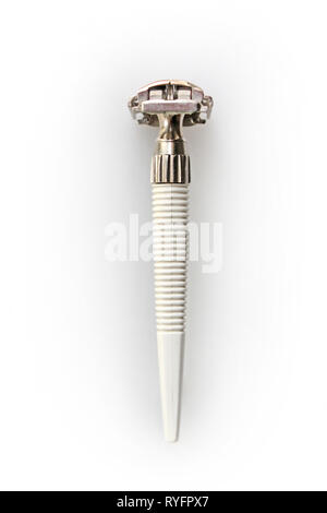 Vintage 60s - 70s gillette safety razor shaver with white plastic handle, isolated on a white background, close-up Stock Photo