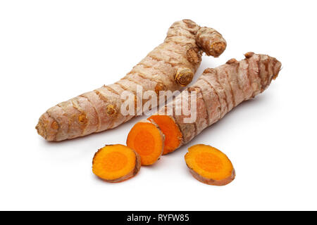 Fresh whole turmeric root and slices isolated on white background Stock Photo