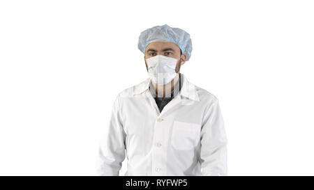 Mature surgery in a mask walking Front view on white background. Stock Photo
