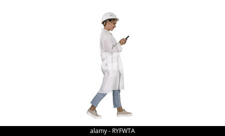Female Scientist Using Smartphone Walking on white background. Stock Photo