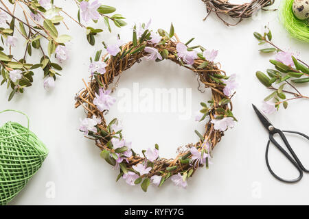 Spring wreath with flowers. Creative flat lay. Top view. Happy easter.