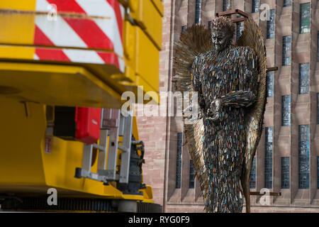 A Knife Angel sculpture, made of 100,000 confiscated knives, is installed at Coventry Cathedral. The 27-foot high artwork, created by artist Alfie Bradley, starts its residence at the cathedral until April 23 'as a physical reminder of the effects of violence and aggression'. Coventry Cathedral, Priory Street, Coventry. Stock Photo