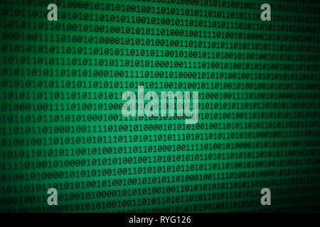 big data analysis. green binary code on led panel with black background and eyeglasses placed over the information panel. hacker and source code analy Stock Photo