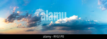Panorama background of dramatic cloudscape and skyscape with stormy clouds in sunset Stock Photo