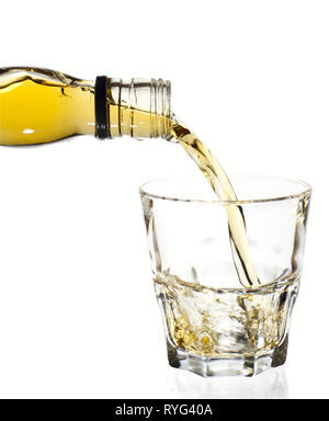 Irish whiskey is poured in tumbler glass, isolated, clipping path Stock Photo