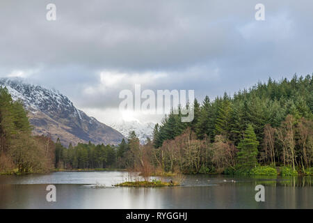 Glencoe Lochan in winter above the village of Glencoe in the Scottish Highlands. Views from the lochan are superb, ao it's very popular with walkers.. Stock Photo