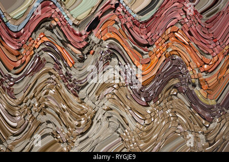 Multicolored quilling paper curved stripes forming a bright background Stock Photo