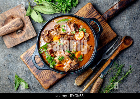 Beef ribs Bourguignon. Beef ribs stewed with carrot, onion in red wine. France dish Stock Photo