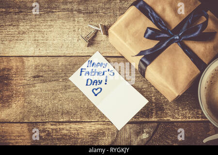 Fathers day concept - present, coffee, tie, mustache Stock Photo