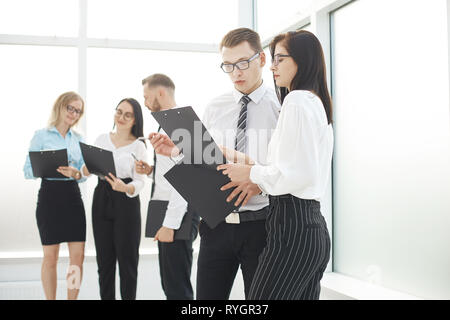group of business people discussing business documents Stock Photo