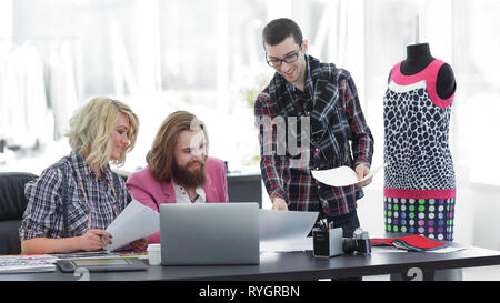 team of designers discussing new ideas in the Studio Stock Photo