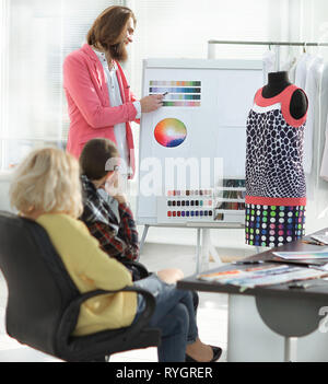 group of designers discussing the color palette Stock Photo