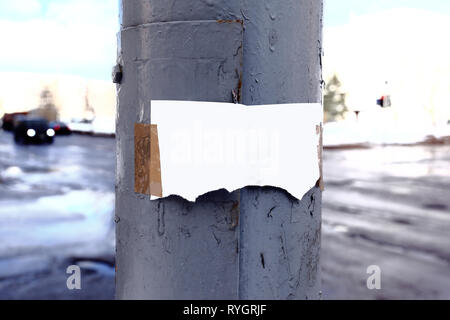 two ripped a blank sheet on the old fence Stock Photo