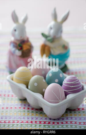 Dyed Easter eggs with toy rabbit Stock Photo