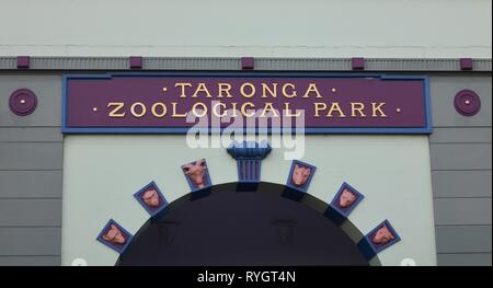 Facade of original entrance to Sydney's Taronga Zoo in Australia showing typography detail with letters painted in gold and ornamentation Stock Photo