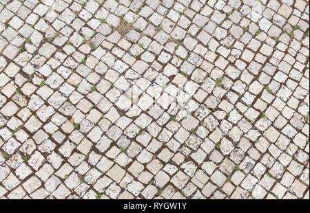 Abstract background of old cobblestone pavement close-up. Stock Photo