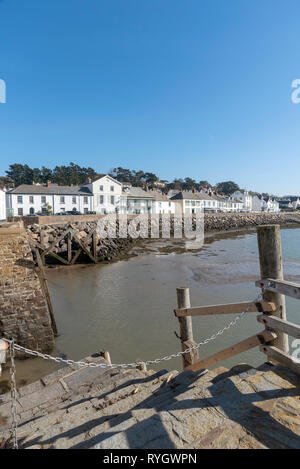 Instow, North Devon, England, UK. March 2019. Instow viewed from the harbour steps over the River Kerridge estuary. Stock Photo