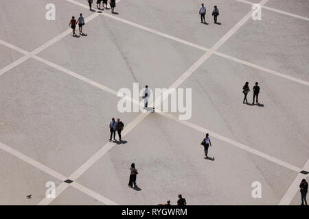 Aerial view of a group of people walking in a square in the city of Lisbon in Portugal Stock Photo