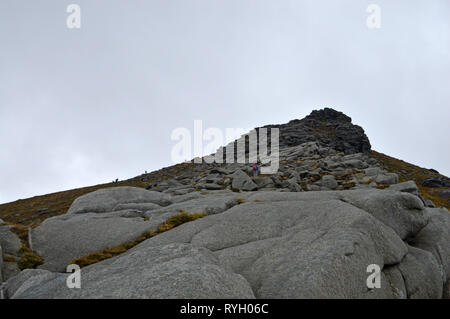 Walkers on summit of Goatfell, Isle of Arran Stock Photo
