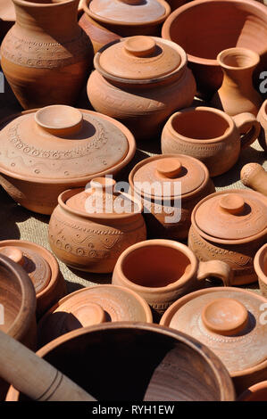 Lots of traditional ukrainian handmade clay pottery production, vertical composition Stock Photo