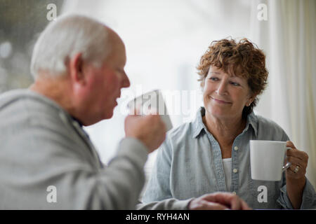 Senior couple drinking cups of tea. Stock Photo