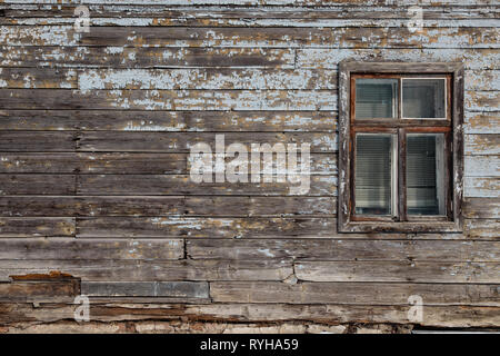 Blank ad space on a wooden old wall in the street outside Stock Photo