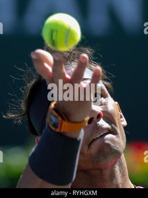 Indian Wells, USA. 13th Mar, 2019. Rafael Nadal of Spain serves during the men's singles fourth round match against Filip Krajinovic of Serbia at the BNP Paribas Open tennis tournament in Indian Wells, California, the United States, March 13, 2019. Nadal won 2-0. Credit: Zhao Hanrong/Xinhua/Alamy Live News Stock Photo