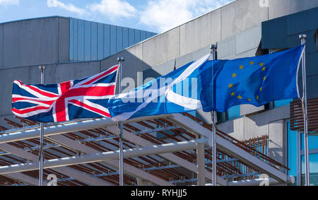 Edinburgh, Scotland, UK. 14 March, 2019. Union Flag, Scottish Saltire and European Union flags flying outside the Scottish Parliament building at Holyrood as Brexit negotiations proceed and the SNP call for another independence referendum in Scotland. Credit: Iain Masterton/Alamy Live News Stock Photo