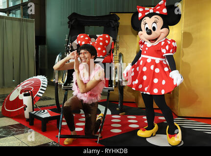 Tokyo, Japan. 14th Mar, 2019. Disney character Minnie Mouse poses with  Japanese comedian Hyokkorihan at an opening event for 