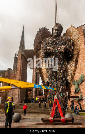 Coventry, West Midlands, UK. 14th March, 2019.  The Knife Angel, which is made up of 100,000 knives which were handed into police forces around the country, was erected outside Coventry Cathedral today. The Knife Angel is a 27 foot high sculpture composed of knives by the artist Alfie Bradley as a physical reminder of the effects of violence and aggression. It is in Coventry until 23rd April. Credit: Andy Gibson/Alamy Live News. Stock Photo