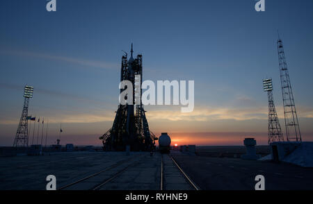 Baikonur, Kazakhstan. 14th Mar, 2019. The Russian Soyuz MS-12 rocket silhouetted by the rising sun on the launch pad as it prepares for launch at the Baikonur Cosmodrome March 14, 2019 in Baikonur, Kazakhstan. The Expedition 59 crew: Nick Hague and Christina Koch of NASA and Alexey Ovchinin of Roscosmos will launch March 14th for a six-and-a-half month mission on the International Space Station. Credit: Planetpix/Alamy Live News Stock Photo