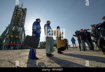 Baikonur, Kazakhstan. 14th Mar, 2019. Russian Orthodox Priest Father Sergei blesses the media and the Russian Soyuz MS-12 rocket on the launch pad as it prepares for liftoff at the Baikonur Cosmodrome March 14, 2019 in Baikonur, Kazakhstan. The Expedition 59 crew: Nick Hague and Christina Koch of NASA and Alexey Ovchinin of Roscosmos will launch March 14th for a six-and-a-half month mission on the International Space Station. Credit: Planetpix/Alamy Live News Stock Photo