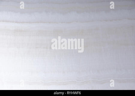 Natural white onyx stone with beautiful waves. Stock Photo