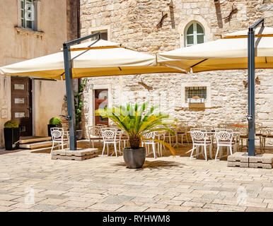 Tables in the restaurant in the open air. Stock Photo