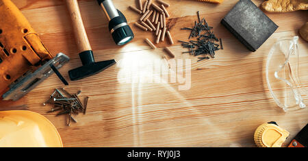 Carpenter woodwork workshop desk top view mock up with various tools around blank copy space of pine wood material Stock Photo