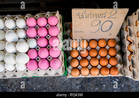 A variety of colored eggs for sale in a market in Khon Kaen, Thailand. Stock Photo