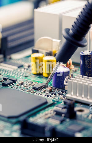 Computer Servising System Multimeter Close Up - Technician engineer measuring multimeter CPU socket computer ...