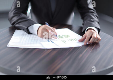 Close-up of Businessman checking financial graphs showing the results Stock Photo