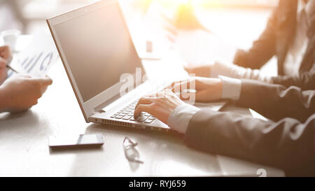 close up. businessman working on a laptop in the office. Stock Photo