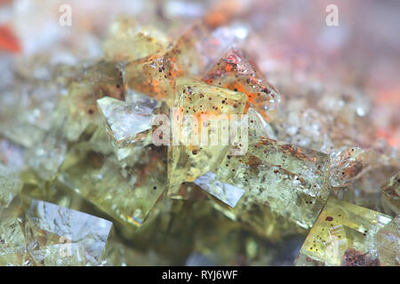 Crystals of fluorite with hematite inclusions from Illo calcite quarry in Finland Stock Photo