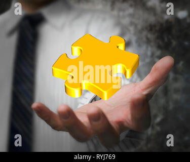 Glowing golden jigsaw puzzle in the businessman hand Stock Photo