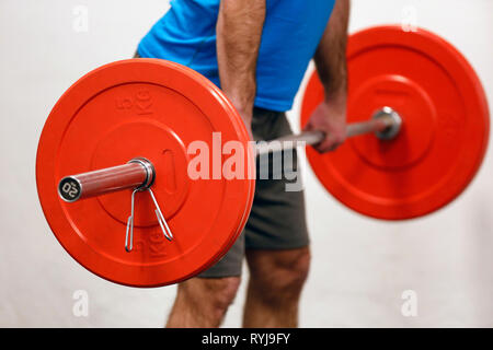 Man lifting weights in gym.  France. Stock Photo