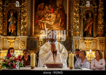 Assumption mass in La Ferriere sur Risle catholic church, Eure, France. Stock Photo