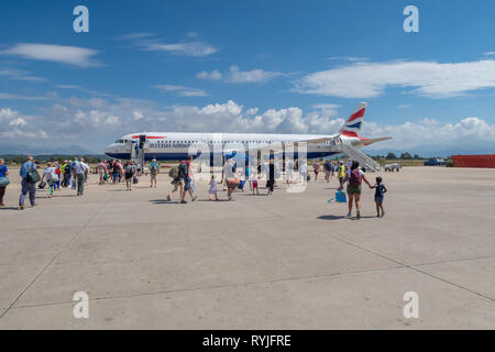 PREVEZA, GREECE - JUNE 10 2018: Passengers walking towards a British Airways airplane on Preveza airport tarmac in Greece Stock Photo