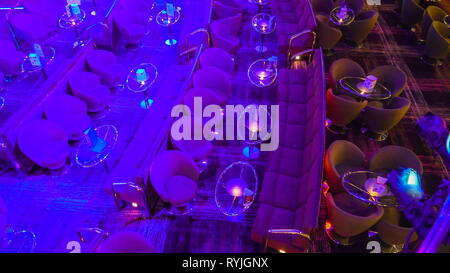 Top view of the glass tables and chairs inside the bar of the casino inside the cruise ship Stock Photo