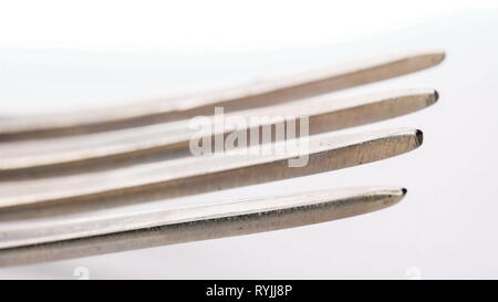 The sharp tip of the mixer beater on a macro shot used for whipping batter Stock Photo