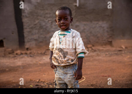 Boy standing in a Ougadougou street, Burkina Faso. Stock Photo