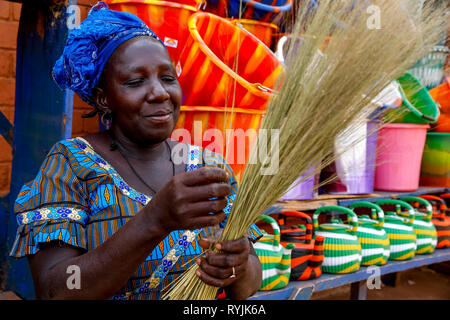 Shopkeeper making craft in Koudougou, Burkina Faso. Stock Photo