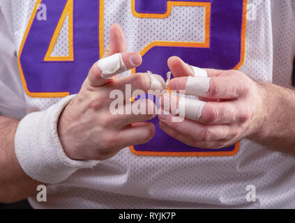 Rough Hands Of American footballer Stock Photo